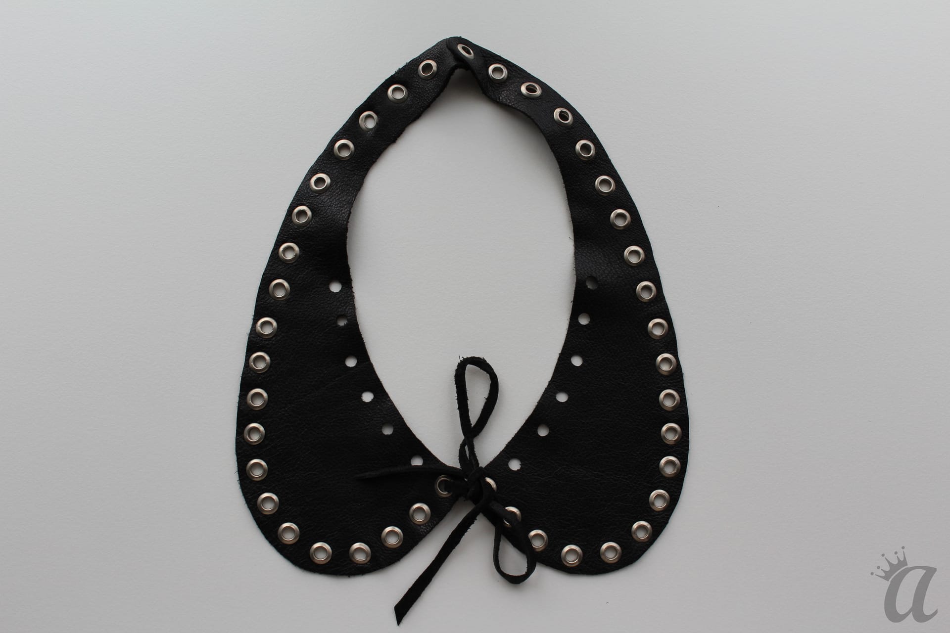 black leather necklace with metal application