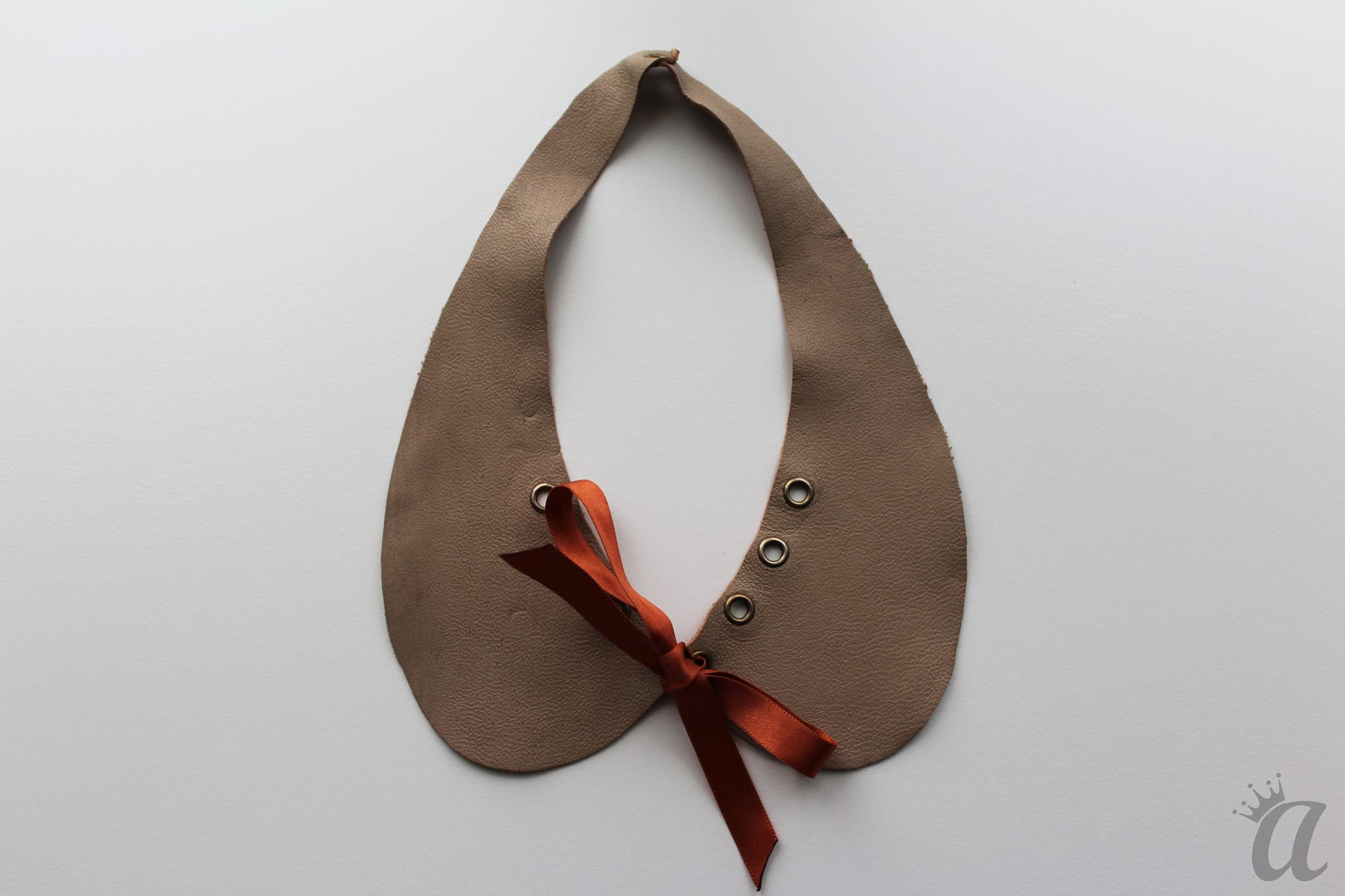 gray leather necklace with brown bow