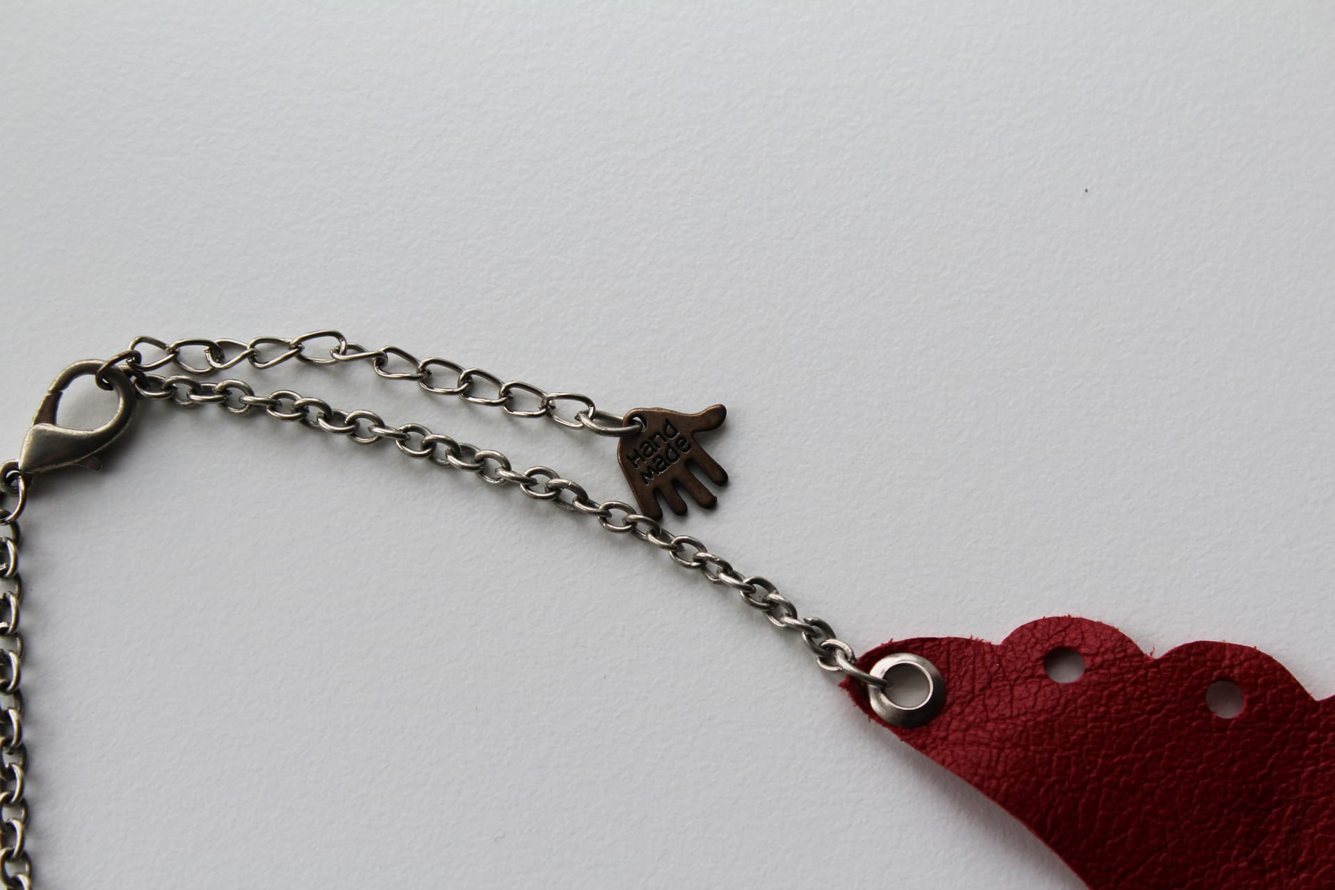 perforated red leather necklace (detail)